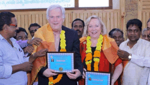 Lovely Indian customs of "shawling" and garlands. Peter & Christine Darg received honorary doctorates from United Evangelical churches of India. 